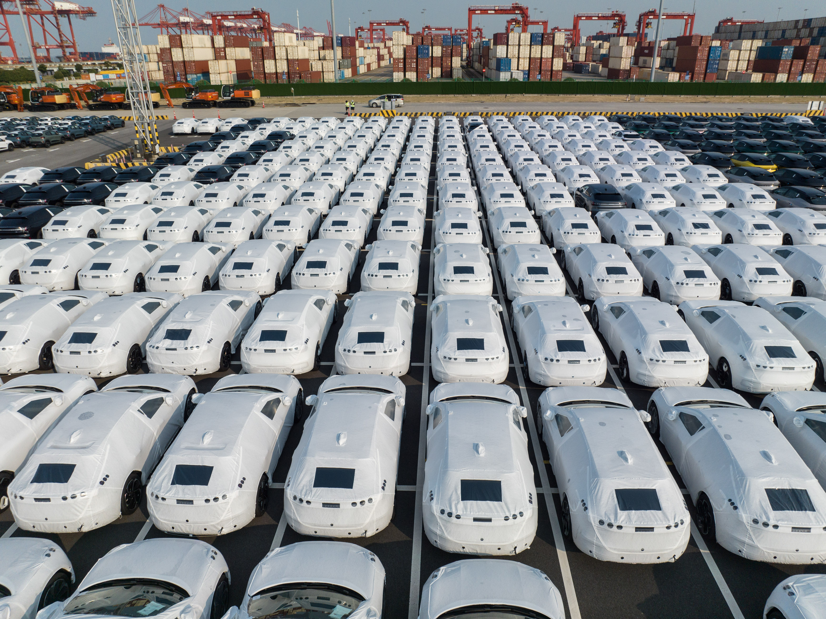 Electric vehicles bound for Europe sit in rows at the Port of Taicang in China. Photo: Bloomberg