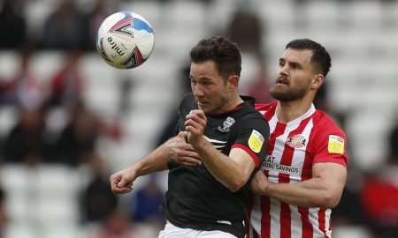 Sunderland's Bailey Wright battles for the ball