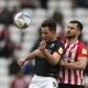 Sunderland's Bailey Wright battles for the ball