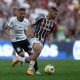 Fluminense's Andre in action with Corinthians' Moraes