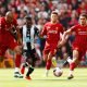 Newcastle United's Christian Atsu in action with Liverpool's Fabinho and Trent Alexander-Arnold