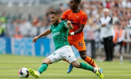 Newcastle United's Rolando Aarons in action with St Etienne's Mathieu Debuchy